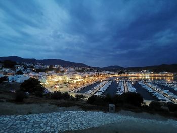 High angle view of illuminated buildings against sky at dusk