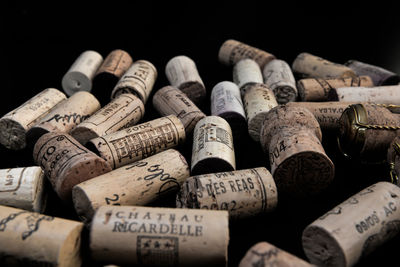 Close-up of beer bottles against black background