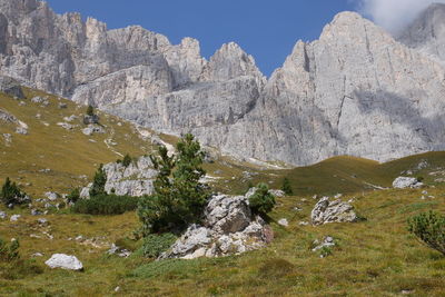 Scenic view of rocky mountains against sky in dolomites, italy