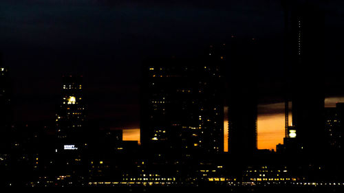 Illuminated buildings in city at night