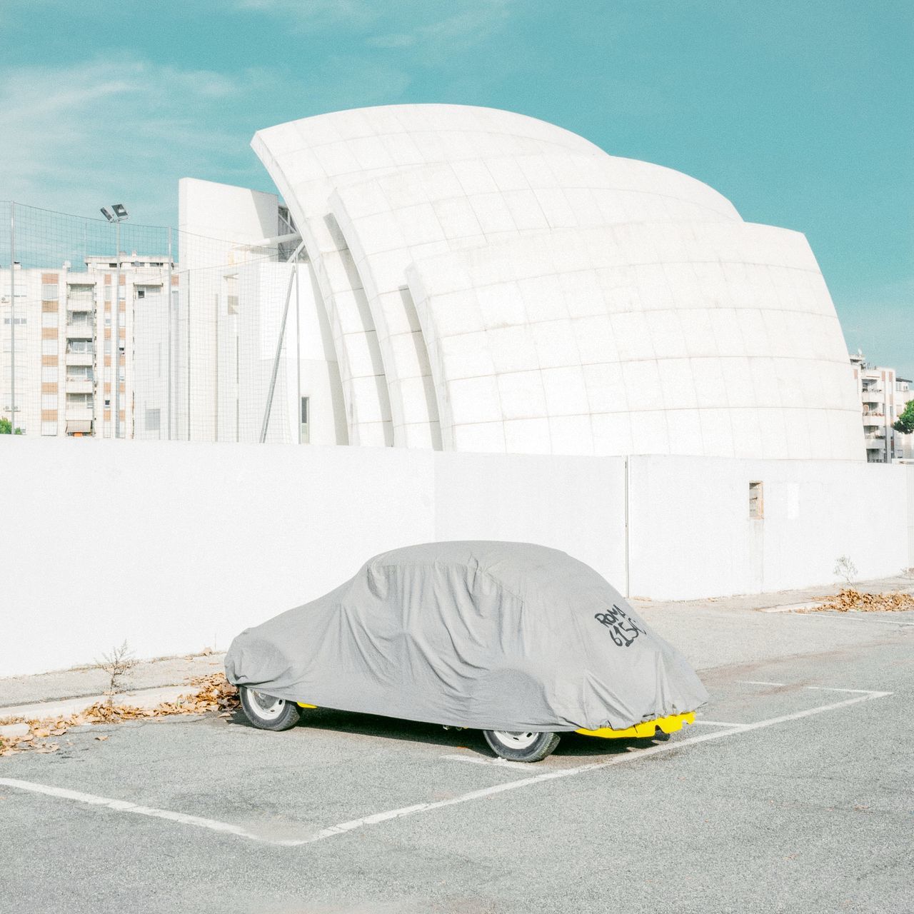 built structure, architecture, building exterior, city, day, real people, street, nature, one person, transportation, road, full length, outdoors, sky, social issues, white color, sleeping, building, lifestyles, hopelessness