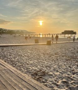 Scenic view of beach against sky during sunset