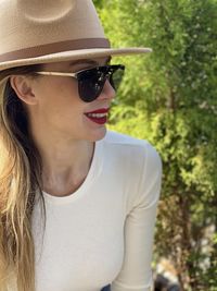 Portrait of young woman wearing hat