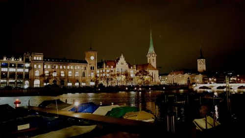 Illuminated buildings in city at night