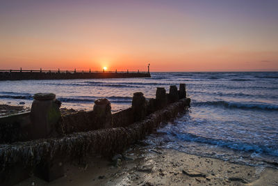 Scenic view of sea against sky during sunset