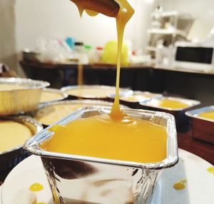 Close-up of yellow pouring drink on table