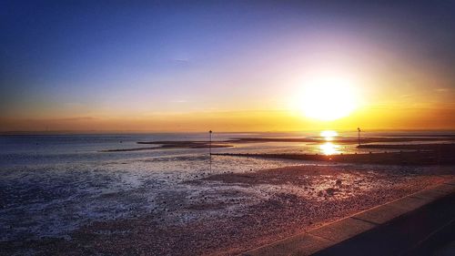 Scenic view of beach during sunset