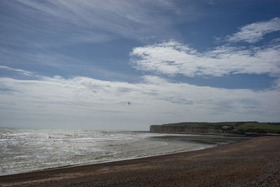 Scenic view of beach against sky