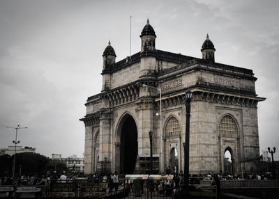 Gateway to india against sky in city