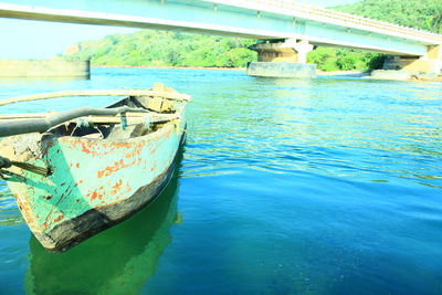 Abandoned boat in river