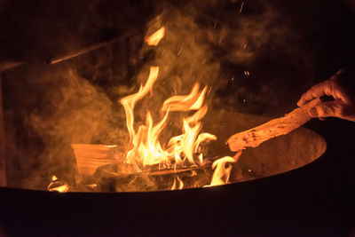 Close-up of fire burning on wood