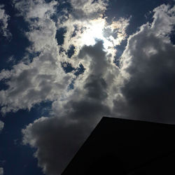 Low angle view of building against cloudy sky