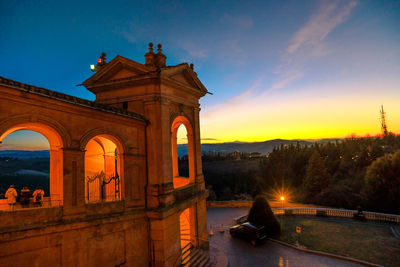 View of historic building against sky during sunset