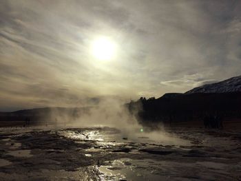 Scenic landscape with steam above a geyser in iceland