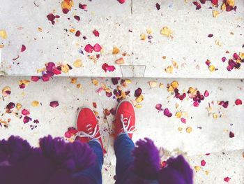 Low section of woman standing on tiled floor