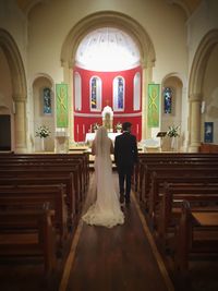 Rear view of man in church