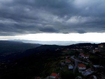 High angle view of townscape against cloudy sky