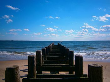 Scenic view of sea against cloudy sky