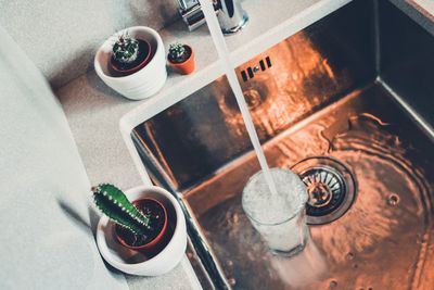 High angle view of water in glass at sink