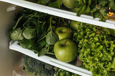 Close-up of apples in container