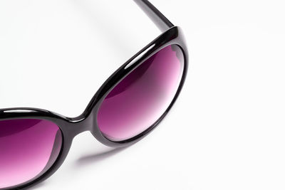 Close-up of sunglasses against white background