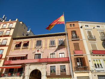 Low angle view of building against blue sky