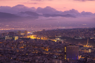 View of foggy north athens from lycabettus hill at sunrise, greece.