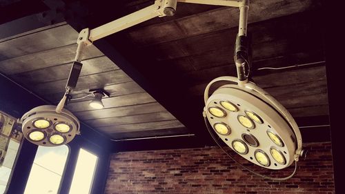 Low angle view of pendant lights hanging on ceiling