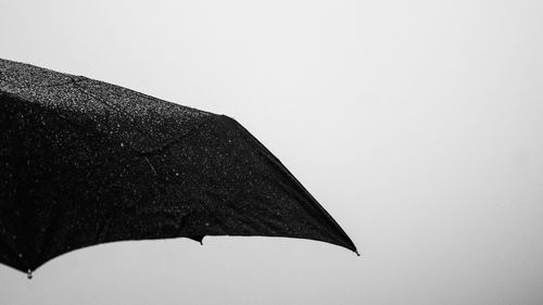 Low angle view of umbrella against clear sky