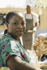 Portrait of young woman on sunny day