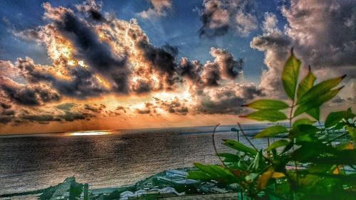 Scenic view of sea against cloudy sky