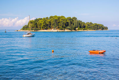 View of sailboat in sea against sky