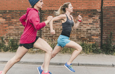 Two women running on the street