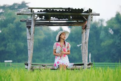 Full length of girl standing on field