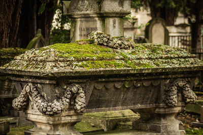 Stone sculpture against temple