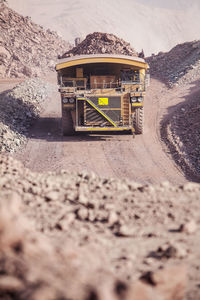 Surface level of road by land against mountain