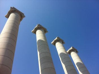 Low angle view of the four columns against clear sky