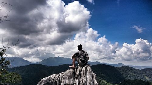 Man in traditional clothing against sky