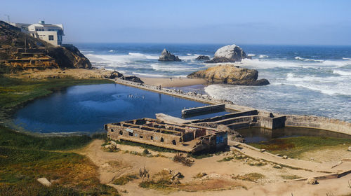 High angle view of sea and buildings against sky