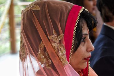 Side view of woman wearing headscarf