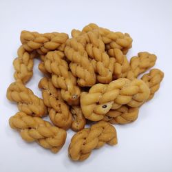 Close-up of bread in plate against white background