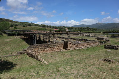 Scenic view of old landscape against sky