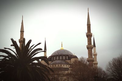 Low angle view of mosque against clear sky