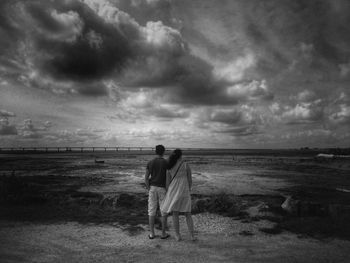 Scenic view of sea against cloudy sky