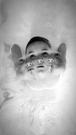 Portrait of young woman in swimming pool