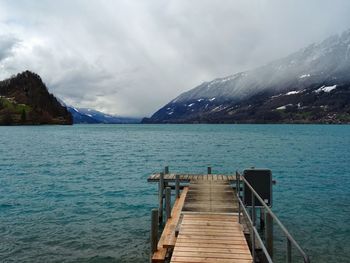 Pier over lake against sky