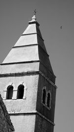 Low angle view of bell tower against sky