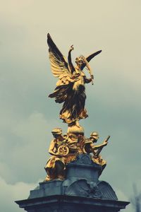 Low angle view of statue against sky