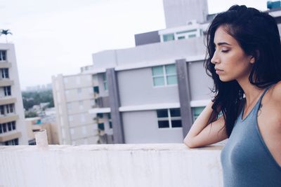 View of woman standing by railing