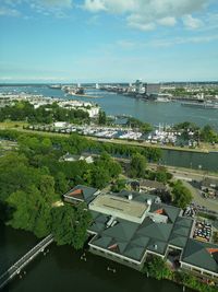 High angle view of buildings and sea against sky